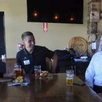 Three Seidman Alumni having a laugh at Social held at Founders Brewing